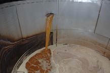 agave juice is pumped into fermentation tanks at hacienda la capilla