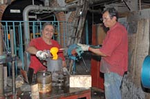 excess molten glass clipped by sheers