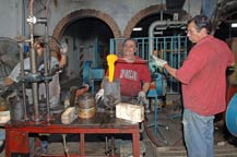 molten glass poured into the shaping mold