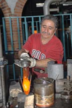 molten glass from the first mold is shaped to fit second mold
