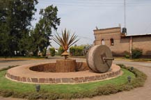 stone tahona at the entrace to tequila centinela in arandas