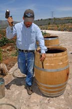 A worker prepares a French white oak barrel at tres mujeres tequila distillery - 2010